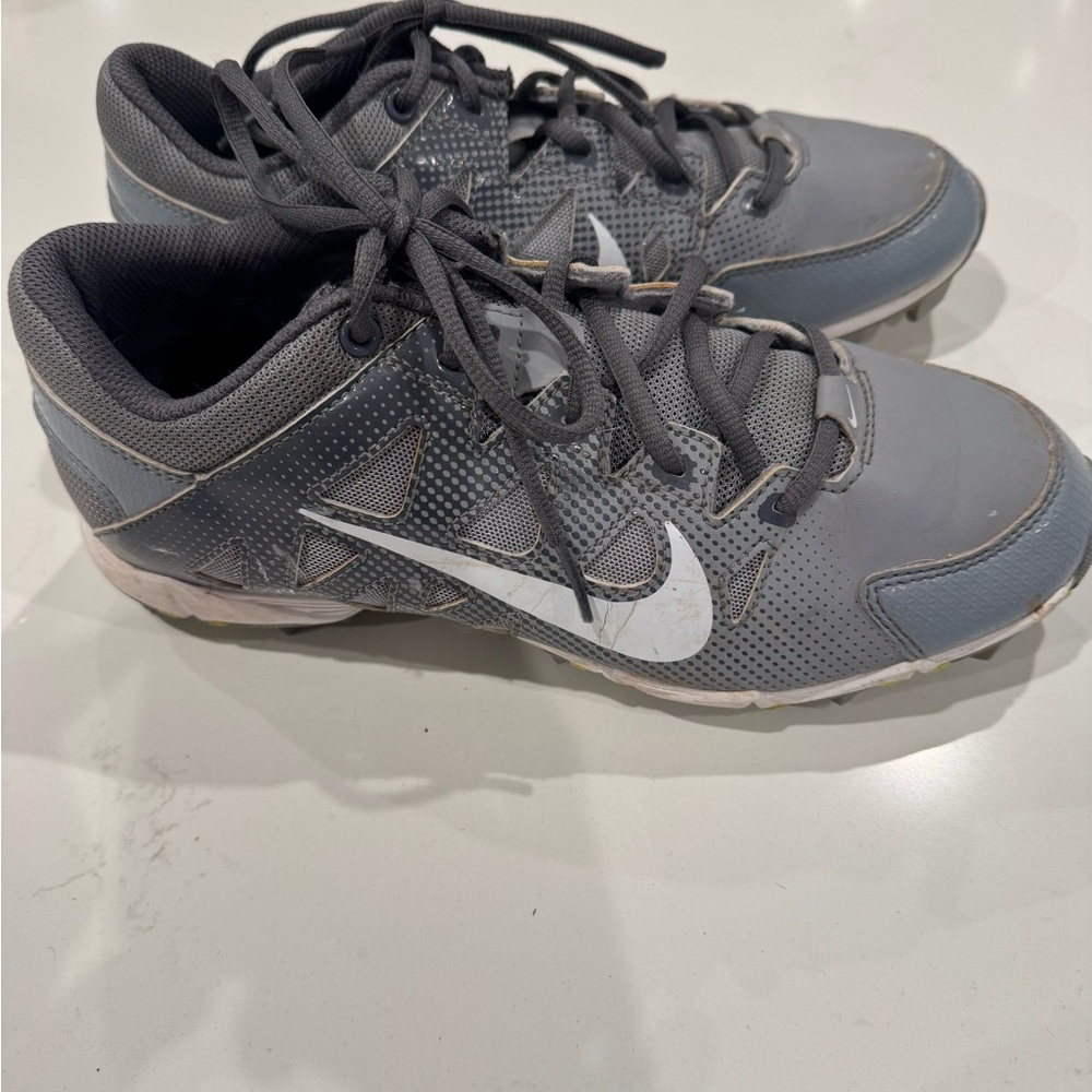 Gray baseball cleats with White Accents